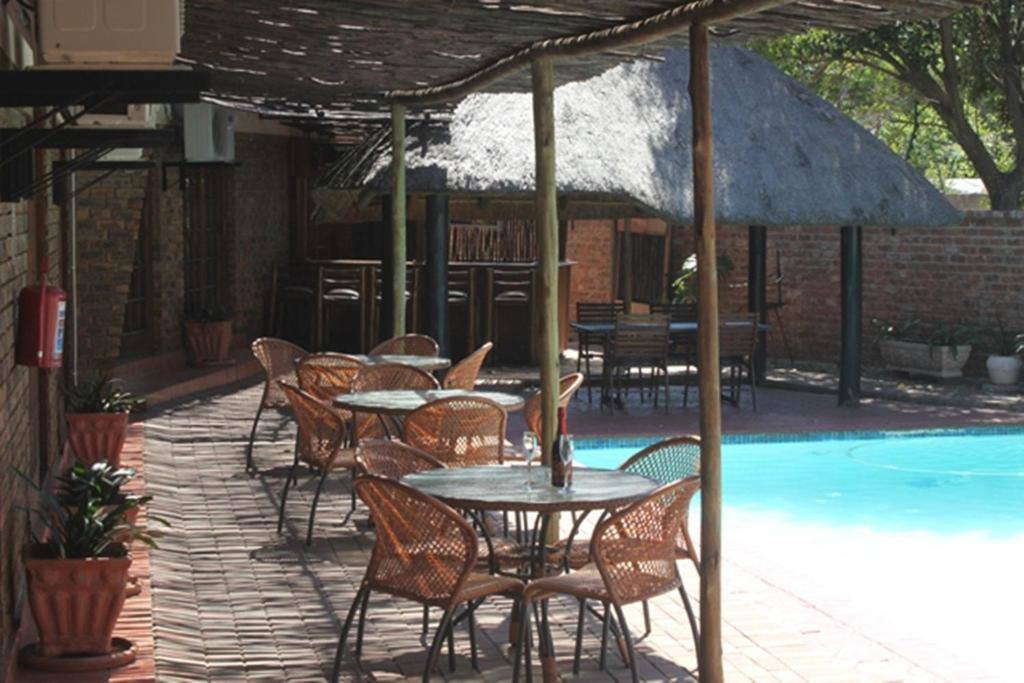 Swimming pool and terrace at Rosenthal Guesthouse